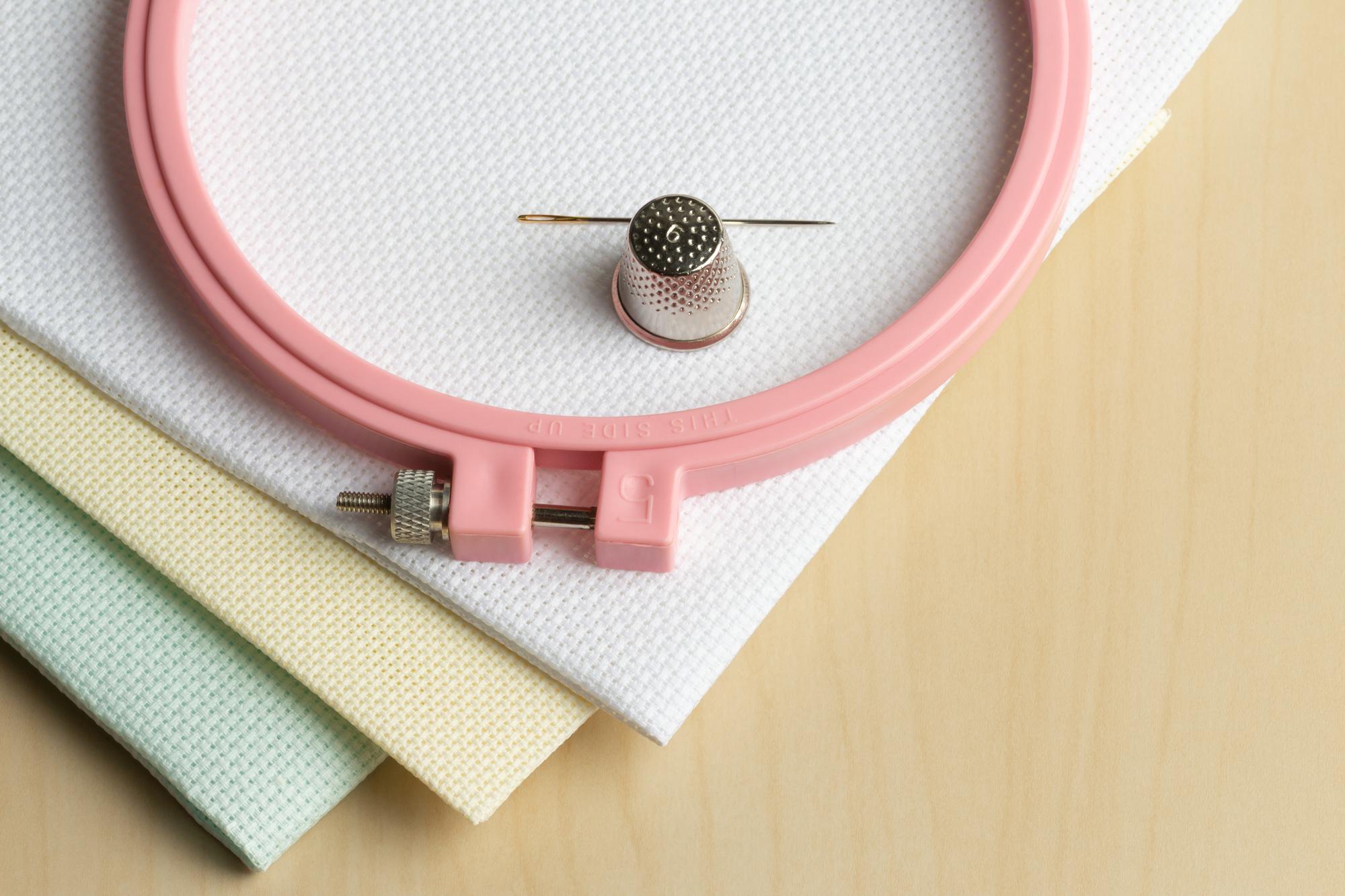 compact hoop with geometric satin stitches